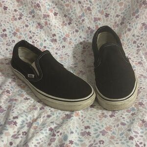 Vans Women’s Black and White Slip-On Sneakers